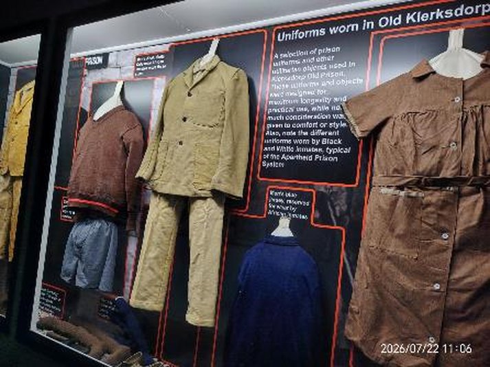 A variety of prison uniforms and other utilitarian objects in one of the permanent exhibitions